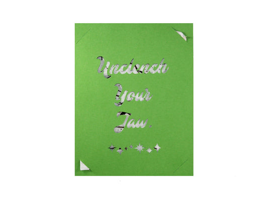 Seed paper card with text that says "Unclench Your Jaw"